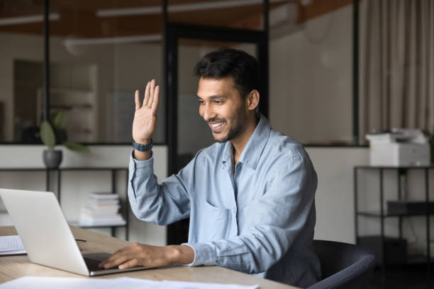 istock Indian businessman engaging in online video call using laptop 2189659640