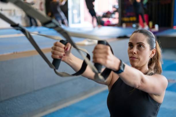 istock Strong woman doing suspension exercises 2189659714