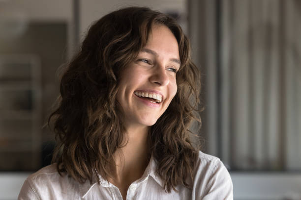 istock Woman laughing, looking away, posing at home or professional space 2189660448