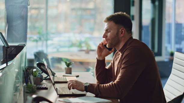 istock Fatigued worker finish call cellphone in modern office closeup. Manager tired 2189661663