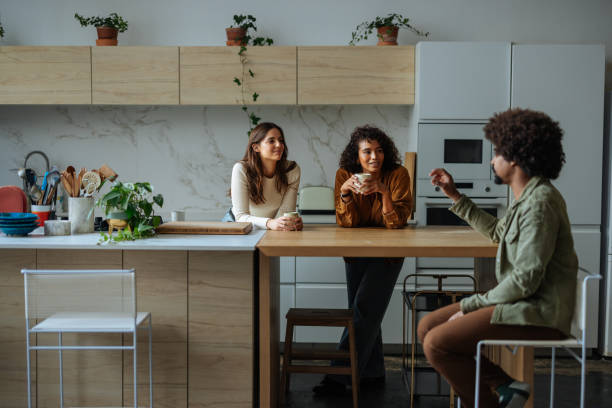 istock Young adults enjoying coffee break in modern kitchen 2189664178