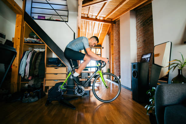 istock Man working out on his indoors cycling turbo trainer 2189664269