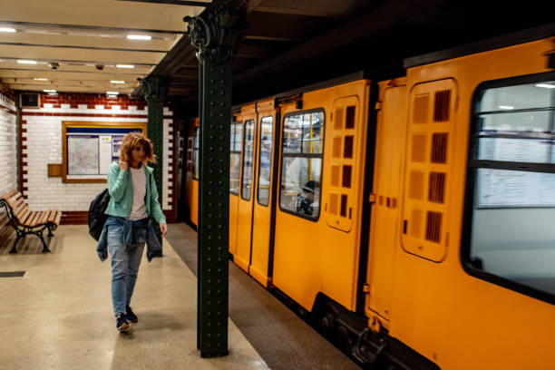 A solo female traveler using a Metro public transportation in Budapest