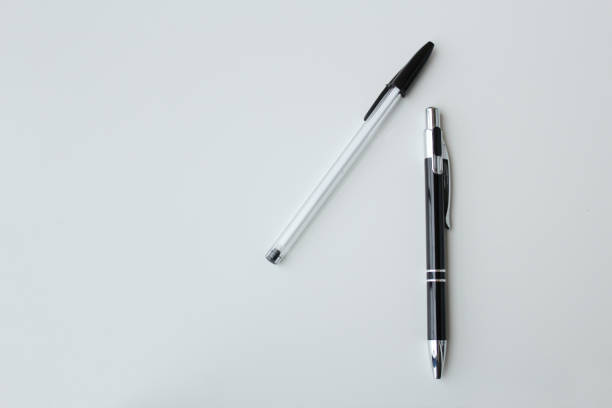 notebook with black pen on the table