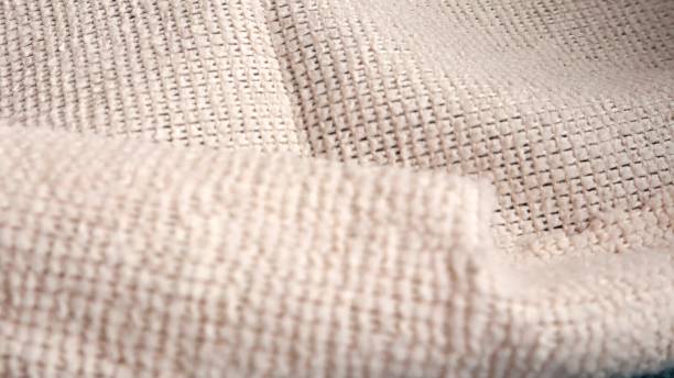 istock Blue and beige microfiber cleaning cloth, highlighted on a white background, Close-up view from above 2189678147
