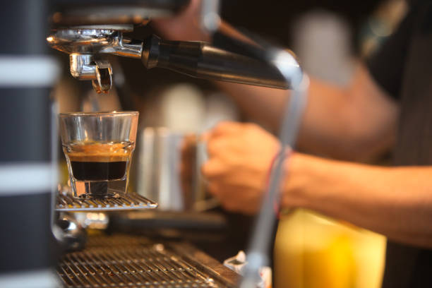 istock hands of barista making coffee in cafe 2189678493