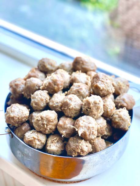 istock Bakso Malang, traditional food from Malang, East Java, Indonesia. Meatballs soup served with noodles, tofu and fried dumpling (pangsit) 2189678641