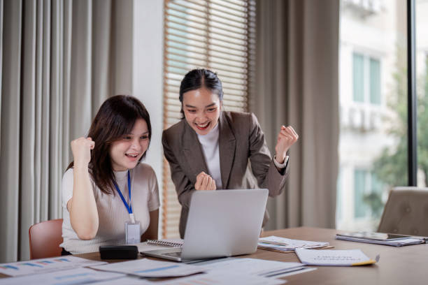 istock Exciting business achievement celebration modern office digital engagement bright atmosphere joyful perspective success concept 2189681411