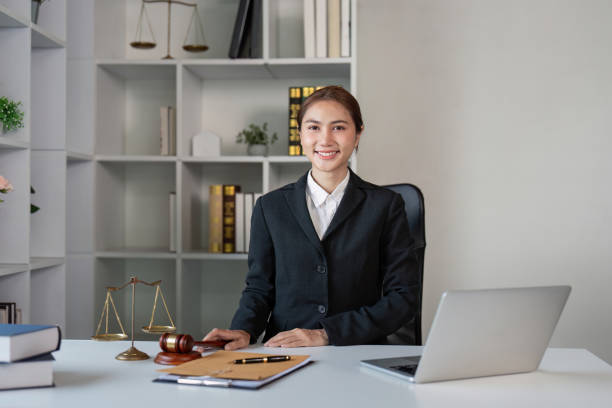 Lawyer in office setting professional workspace business environment workspace perspective legal expertise highlighted A confident lawyer sits in a modern office showcasing professionalism and legal expertise ready to assist clients. civil rights act stock pictures, royalty-free photos & images