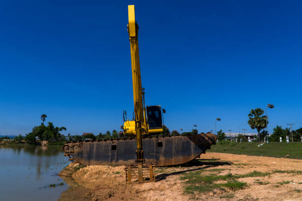 Large tracked dredging digger used for reservoir clearing and deepening in Asia Thailand