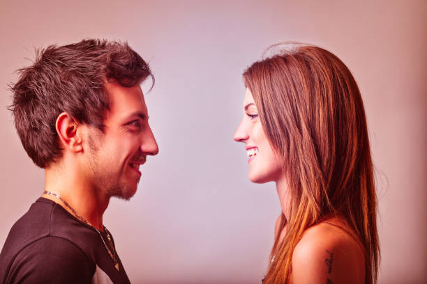 istock Young couple smiling and looking at each other 2189695238
