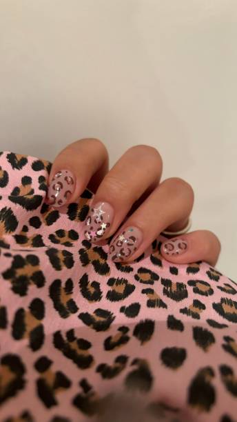 istock Creative nail art featuring intricate designs, vibrant colors, and unique patterns. Perfect for beauty and fashion photography, showcasing trends in nail designs and the artistry of manicure techniques. 2189702915