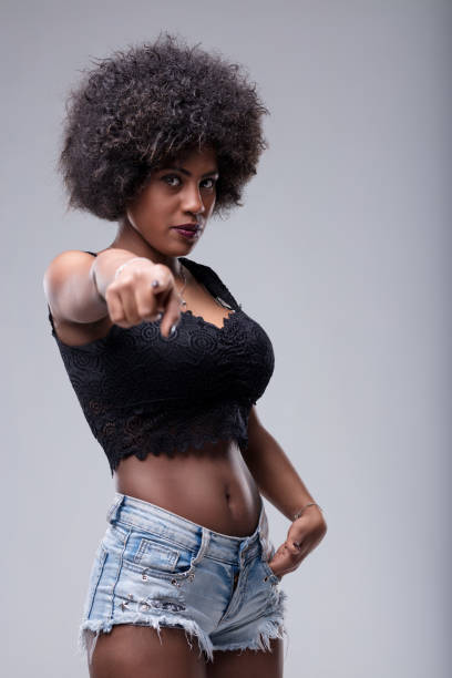istock Young woman pointing finger accusingly at you 2189709116