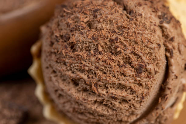 istock chocolate ice cream in a cone on a board 2189710618