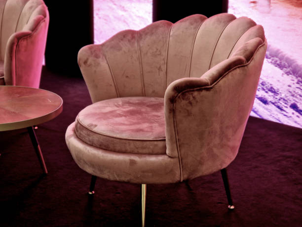 istock a bar or TV studio with a screen on the wall. armchairs with suede surface and gilded details. interview evening show about relationships 2189712370