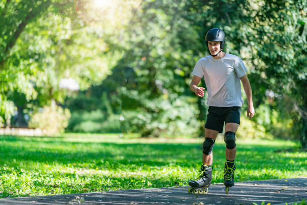 Young man rollerblading outdoors in a park, showcasing agility and energy. This vibrant scene highlights fitness, outdoor fun, and an active lifestyle in a natural park environment