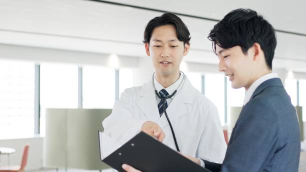 istock A doctor and a salesman talking 2189718546