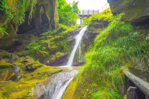 istock Grotto del Cagleron and waterfall in Italy 2189722334