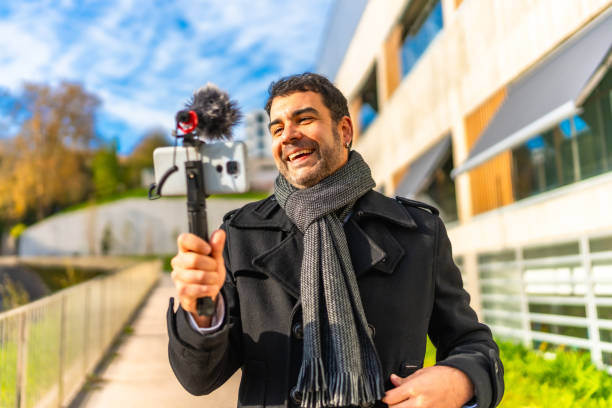 istock Vlogger smile while recording content in the city 2189725194