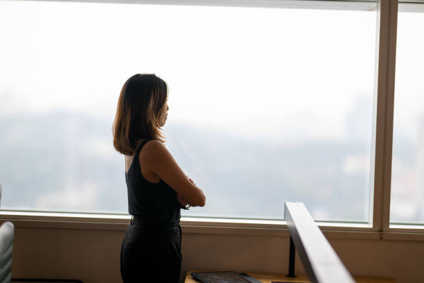 istock Urban Visionary: A Businesswoman’s Reflective Moment 2189726061