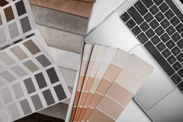 istock different types of fabrics with a color palette and laptop 2189730211