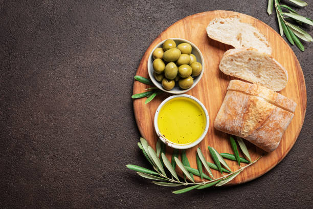 istock Olive Oil, Bread and Green Olives 2189730376