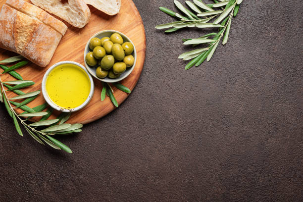 istock Olive oil with olives and bread 2189730377
