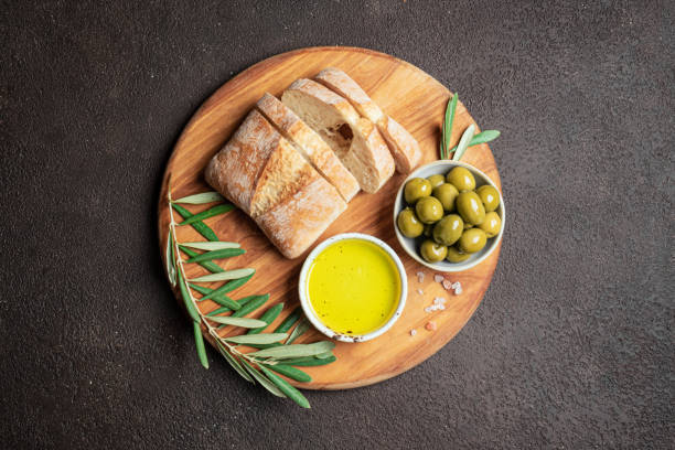 istock Olive Oil, Bread and Green Olives 2189730380