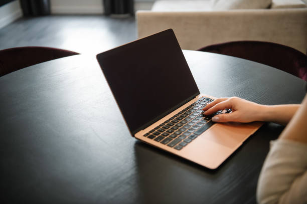 Work on laptop on dark monitor screen. Hands woman working in office. Selling ether, bitcoin or altcoin. Financial stock analysis, trading market research, buying, selling, risk or profit analysis.