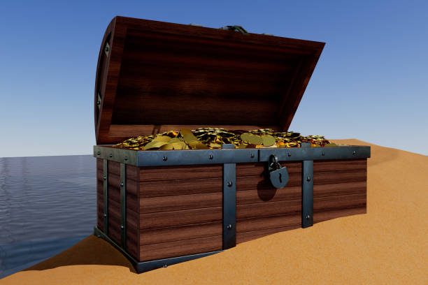 istock A wooden chest with gold coins inside is sitting on a sandy beach 2189733709