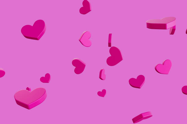 istock A pink background with many hearts scattered around it 2189733772