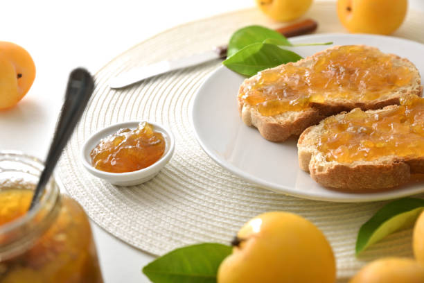 istock White bench with breakfast prepared with plum jam on toast 2189735932