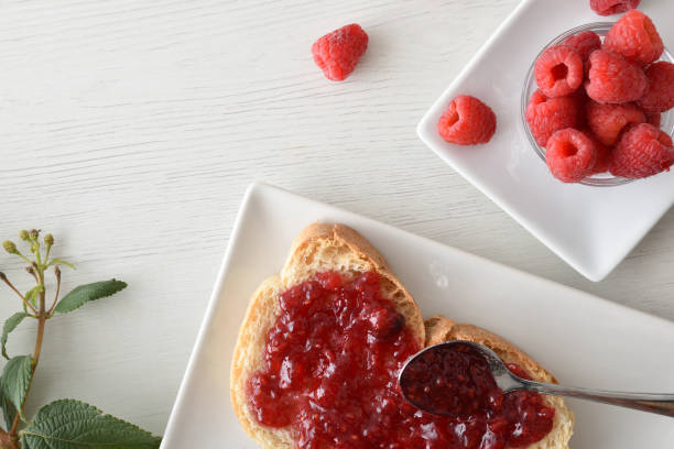 istock Toast with raspberry jam on plate freshly prepared for breakfast 2189735947