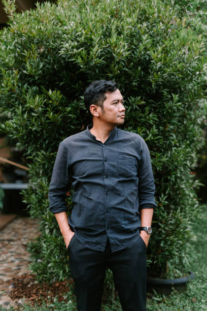 istock A Southeast Asian man casually putting his hands in his pockets, showcasing a relaxed demeanot 2189736320