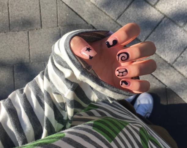 Creative nail art featuring intricate designs, vibrant colors, and unique patterns. Perfect for beauty and fashion photography, showcasing trends in nail designs and the artistry of manicure techniques.