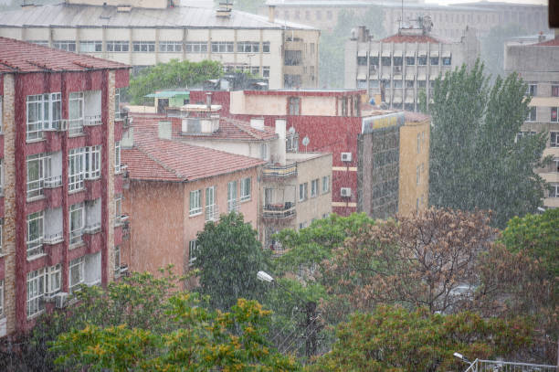 istock Heavy rain falling in the city centre 2189740111