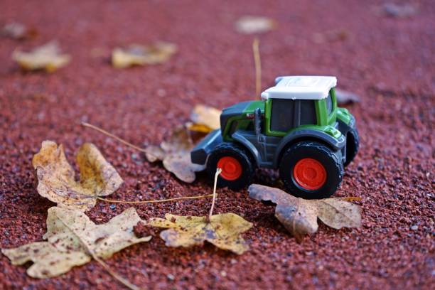 istock Miniature Tractors on Autumn Background 2189740801