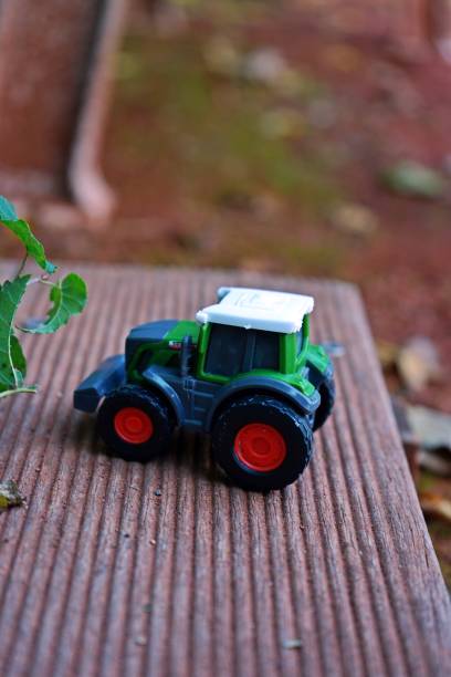 istock Miniature Tractors on Autumn Background 2189740802