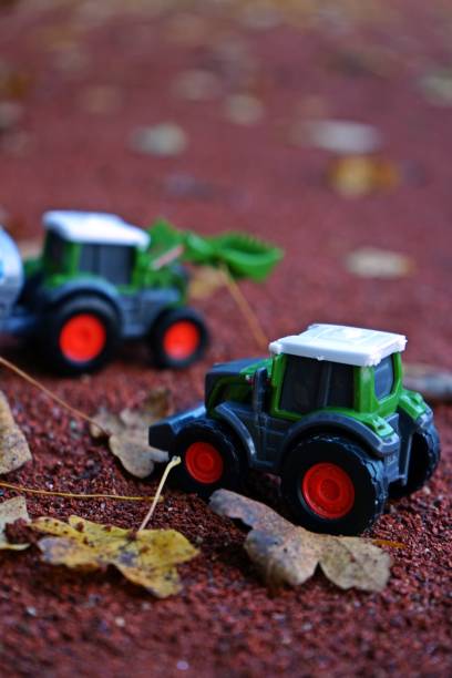 istock Miniature Tractors on Autumn Background 2189740860