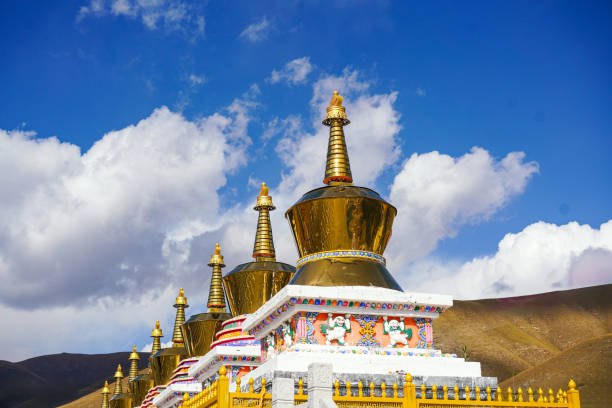 The picture was taken at a Tibetan Buddhist temple in Qinghai Province, China. The pagoda was built to enshrine eminent monks. The outer layer is coated with gold powder and is very dazzling in the sun.