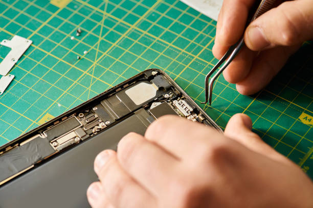 istock Handsome man repairing device at a service center during business hours 2189743931