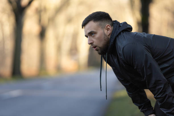 istock A young man catches his breath during an outdoor running workout 2189744076