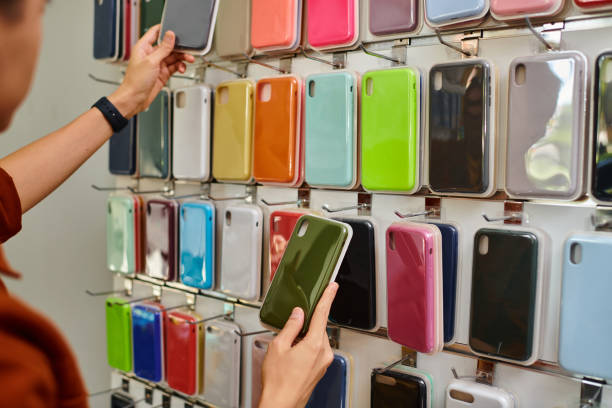 istock Handsome man selecting phone cases in a service center during business hours 2189744246