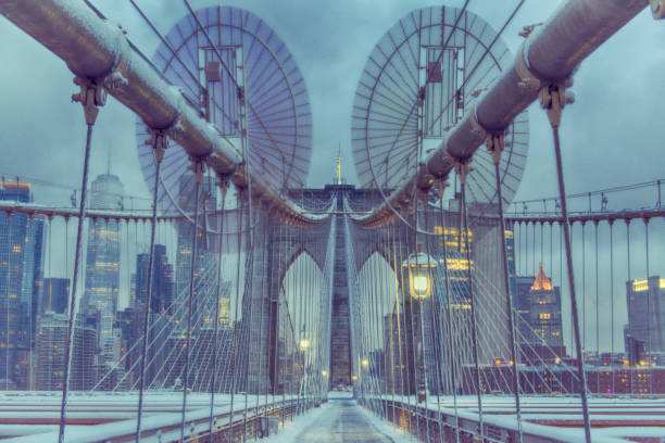 istock Brooklyn bridge covered in snow with view on Manhattan financial district 2189746269