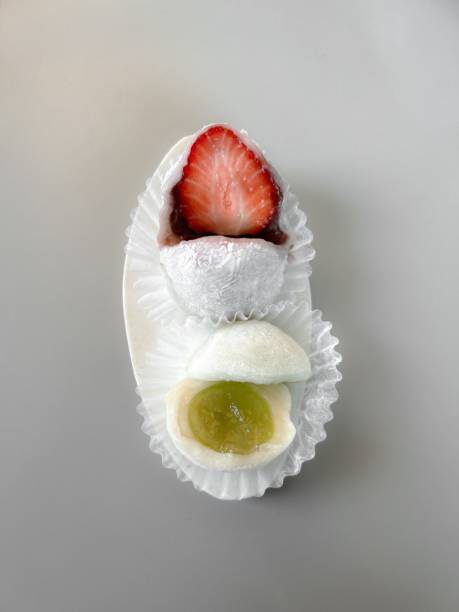 Mochi is a Japanese cake made from glutinous rice, pounded until it is soft and sticky, then shaped into a round shape. Various colors of mochi cake, traditional Japanese food