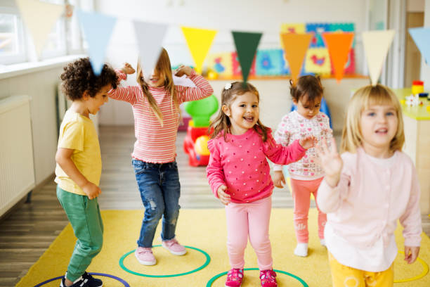 istock Children play with hoops in the playroom 2189747036