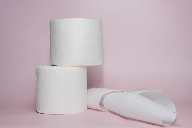 istock Toilet paper rolls creatively arranged on a pastel pink background. The minimalist setting highlights hygiene, cleanliness, and daily essentials 2189749714