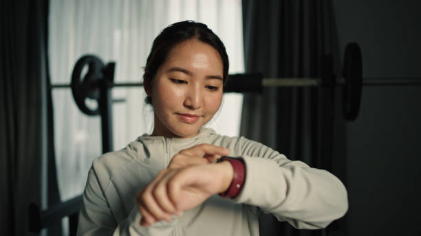 istock Woman using smartwatch at gym. 2189751447
