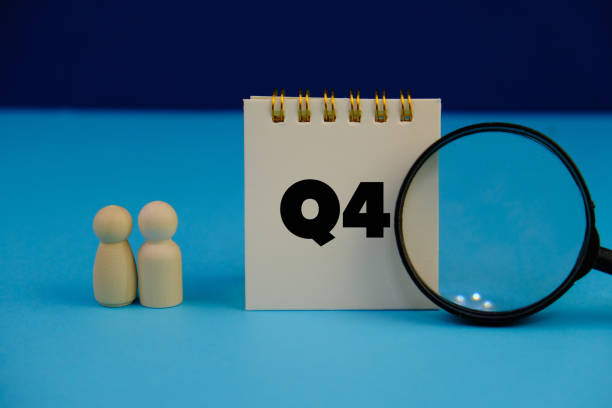 istock Close up of white notebook with alphabet Q4 on office desk. Fourth quarter concept. 2189756071