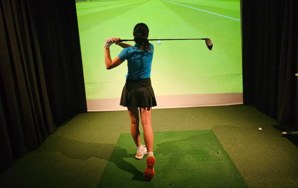 istock Indoor golf practice session with a player swinging a driver in a simulated environment concept 2189756454